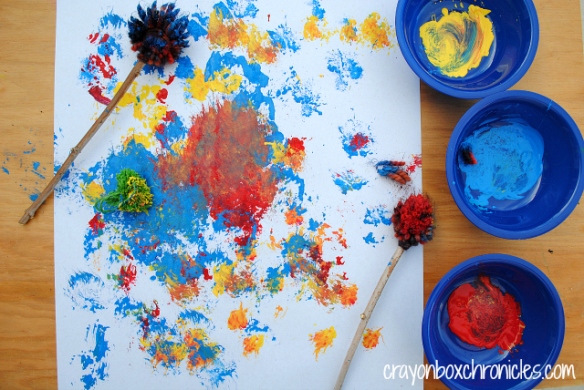 http://crayonboxchronicles.com/2014/01/29/yarn-pom-pom-drumstick-painting/