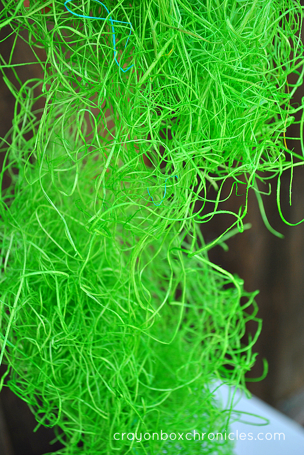 green colored hay for sensory play and crafts